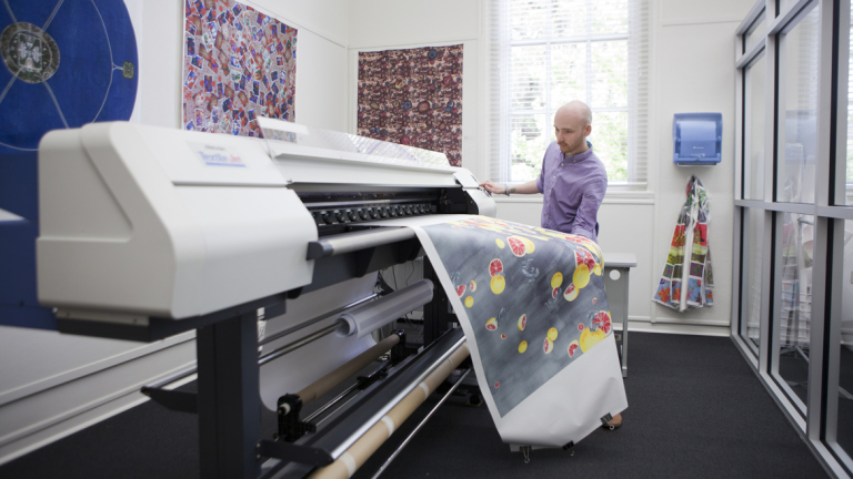 Fibers student using fiber printer at Pepe Hall