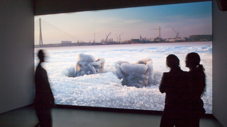 Gallery attendees viewing video installation Gallery attendees viewing video installation by Sigalit Landau