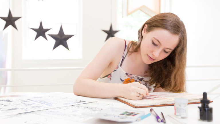 Sequential art student sketching in Hayman's Hall