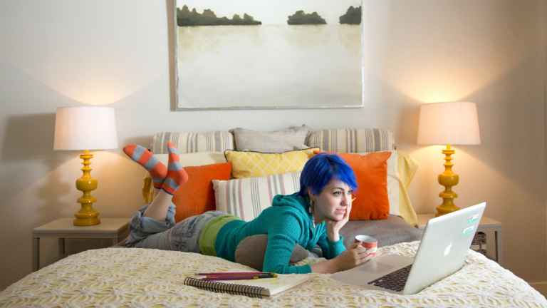 Online student working from home eLearning student using laptop in bedroom