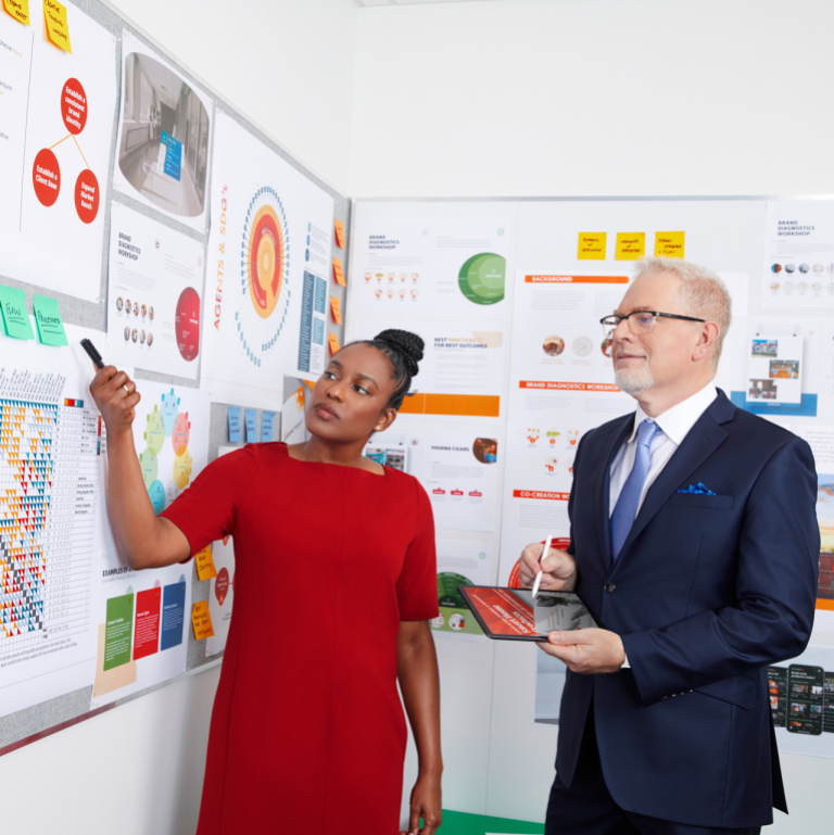 Design management student and professor review a project