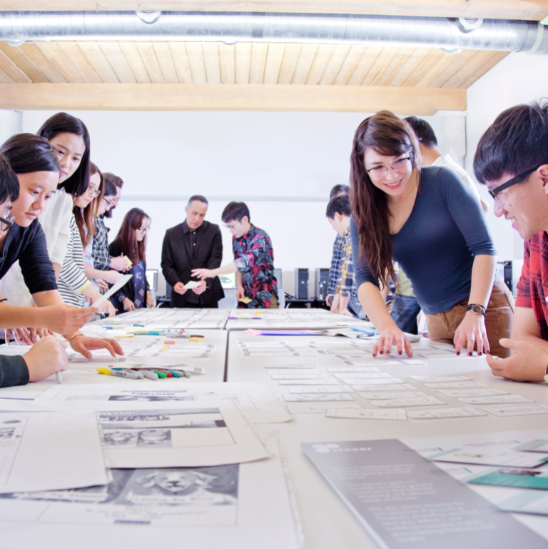 User experience design students collaborate in the classroom