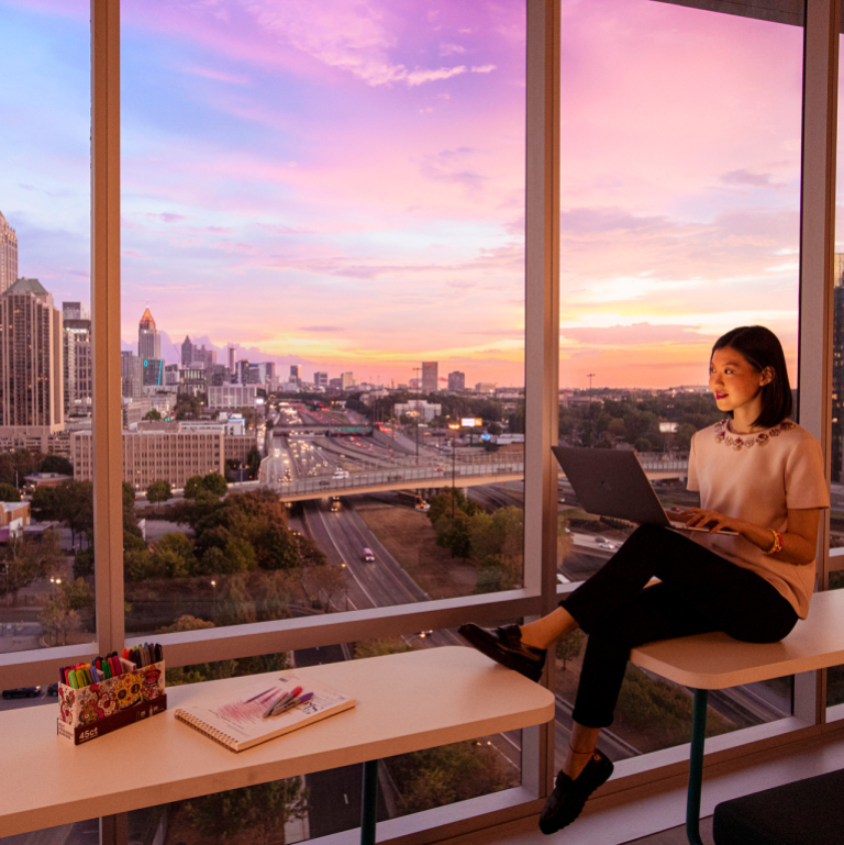 SCAD student studying with view of skyline
