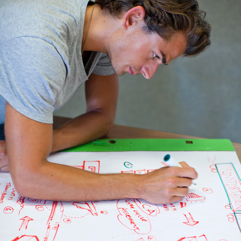 SCAD student drawing diagram